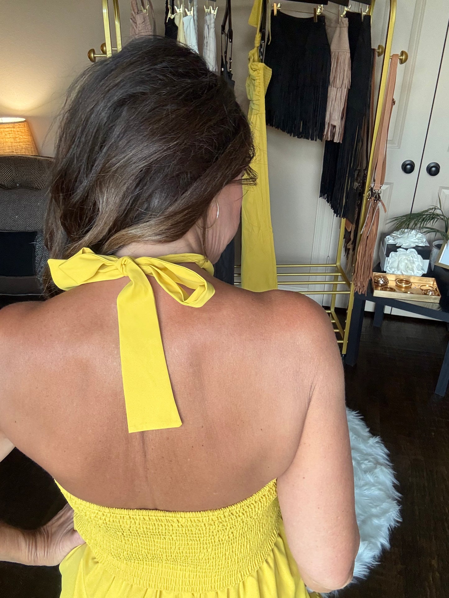 Person wearing a yellow dress with a blurred background