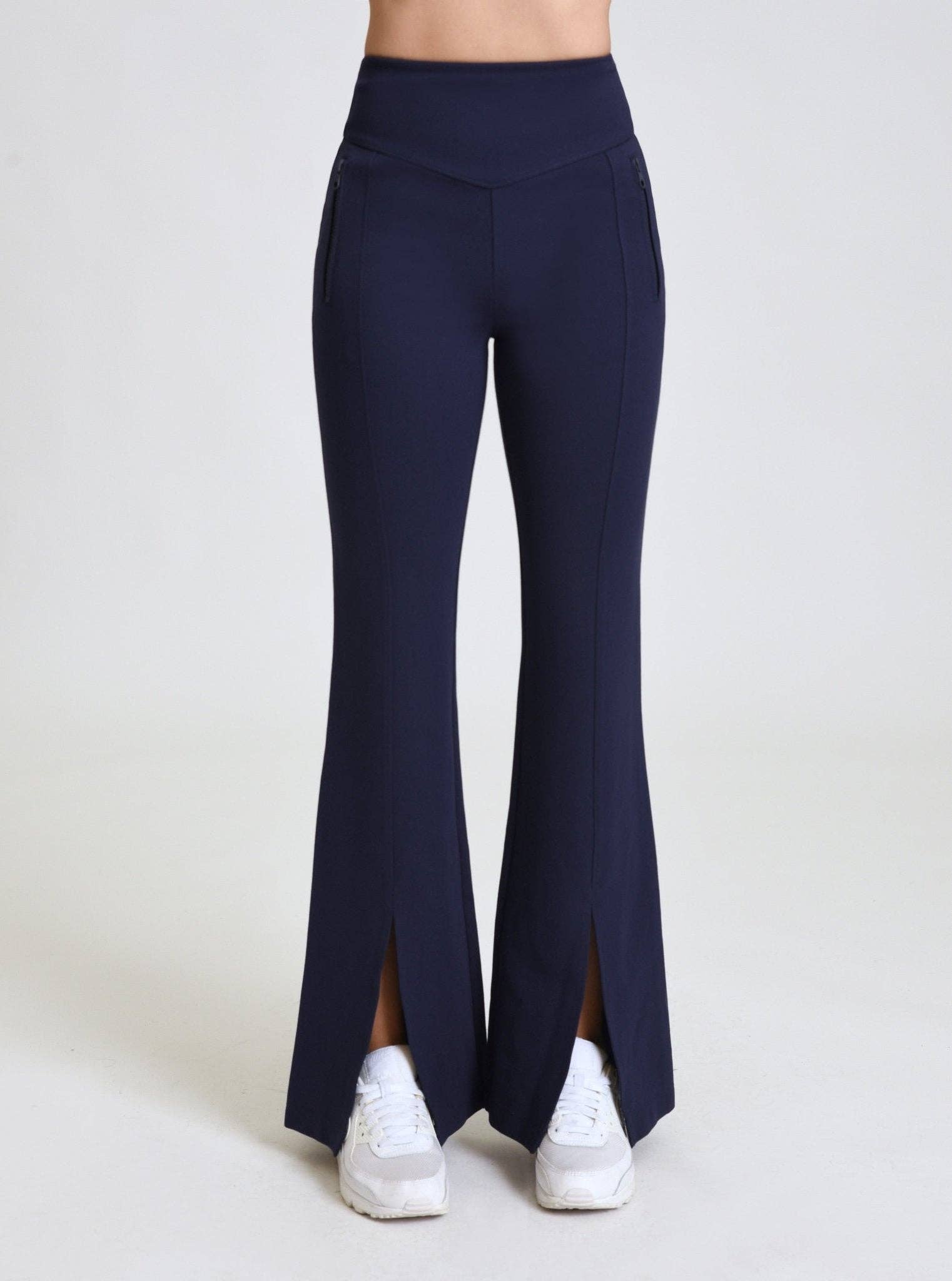Navy blue leggings with a slit on a white background