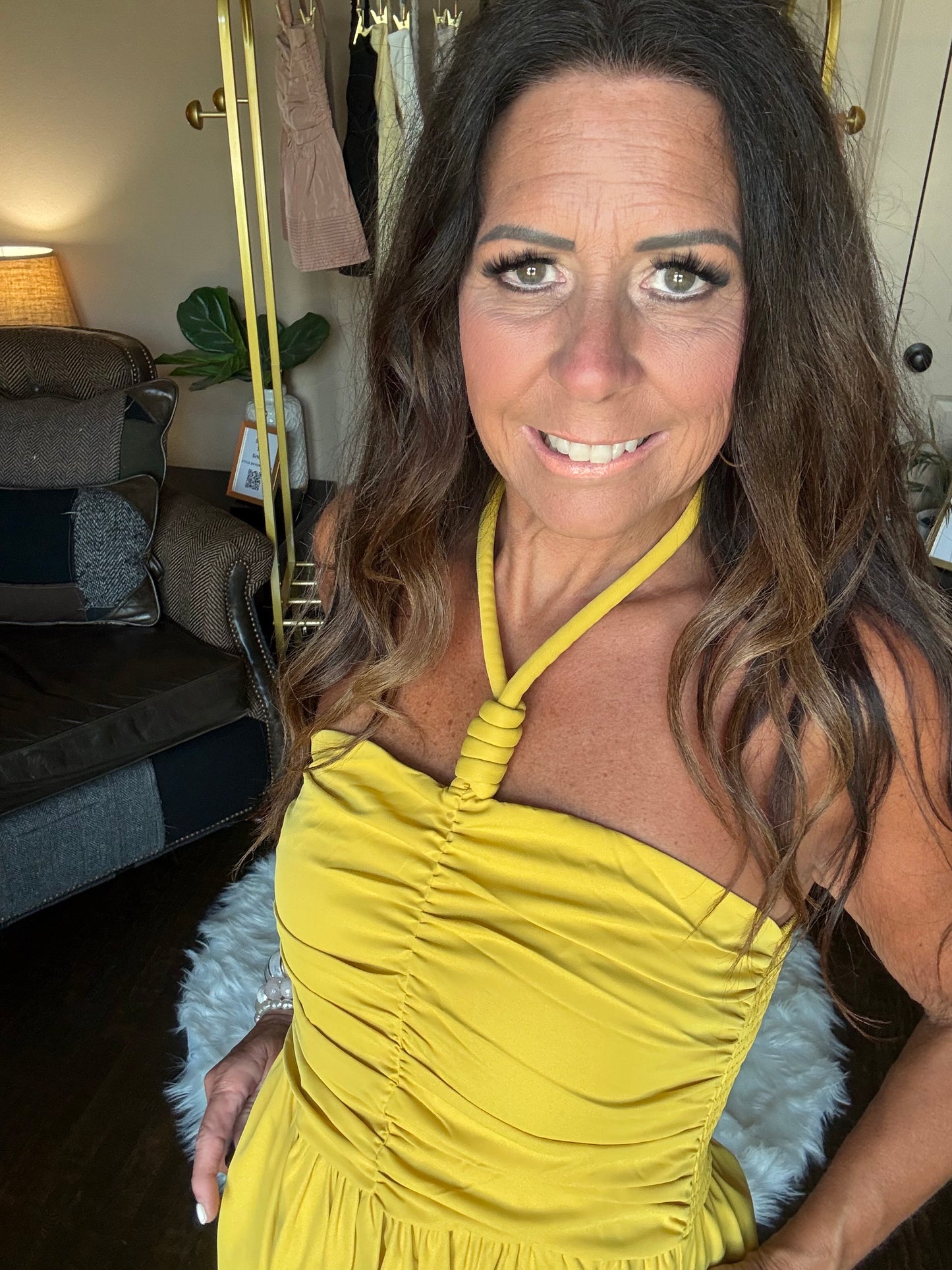 Woman wearing a yellow top with a blurred background
