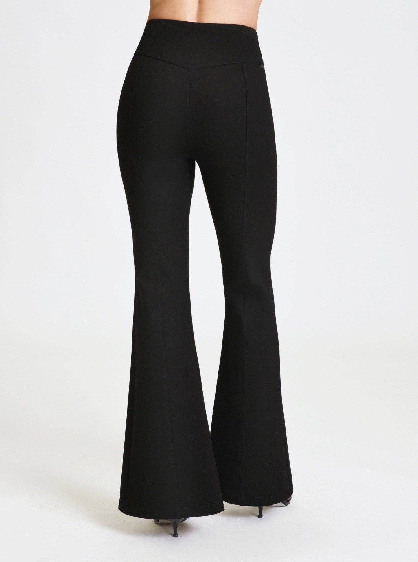 Black flared pants on a white background