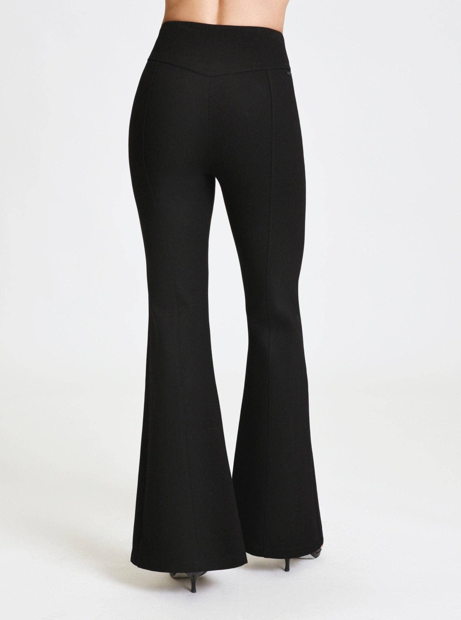 Black flared pants on a white background