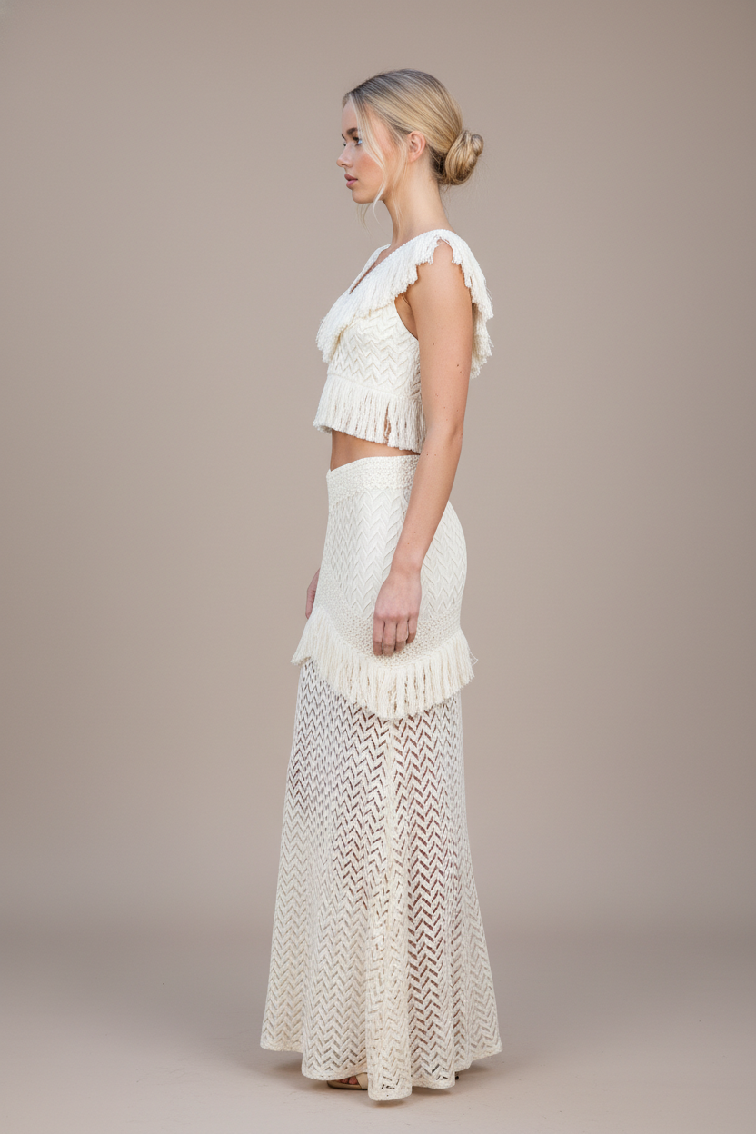 Woman wearing a white lace outfit on a plain background