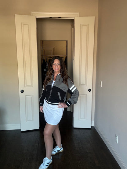Woman standing in a room with white doors and neutral walls