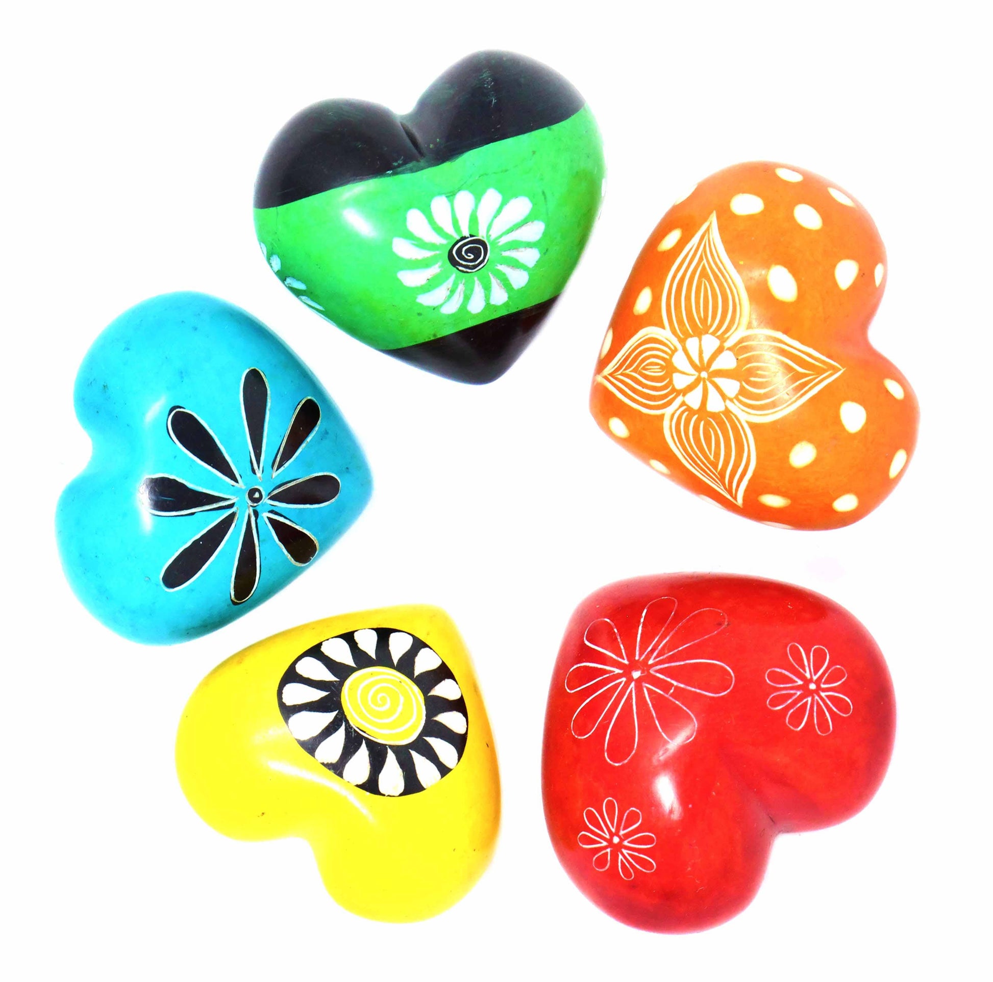 Four colorful heart-shaped objects with floral patterns on a white background