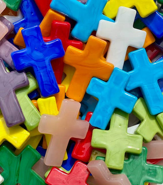 Colorful plastic letter 'X' shapes in various sizes and colors.
