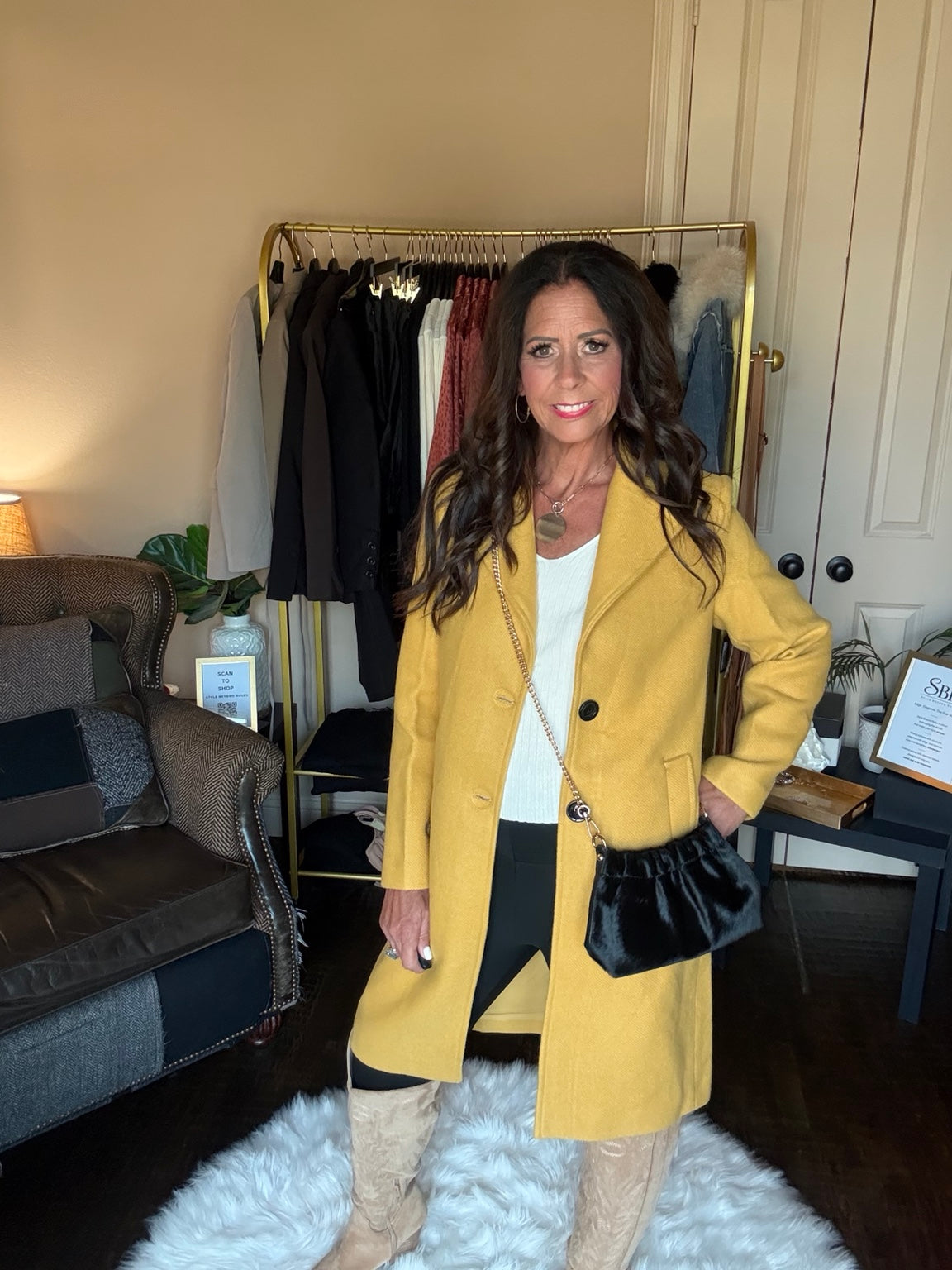 Janet modeling The Autumn Stroll Coat in Yellow with a black crossbody bag