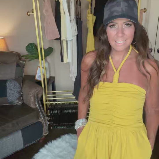 woman modeling a yellow dress