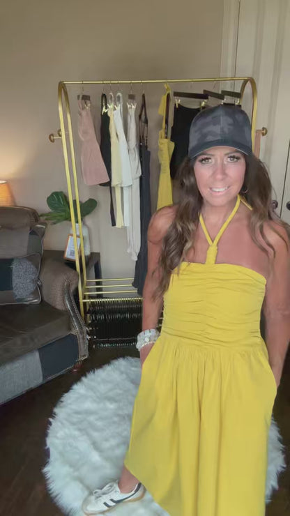 woman modeling a yellow dress